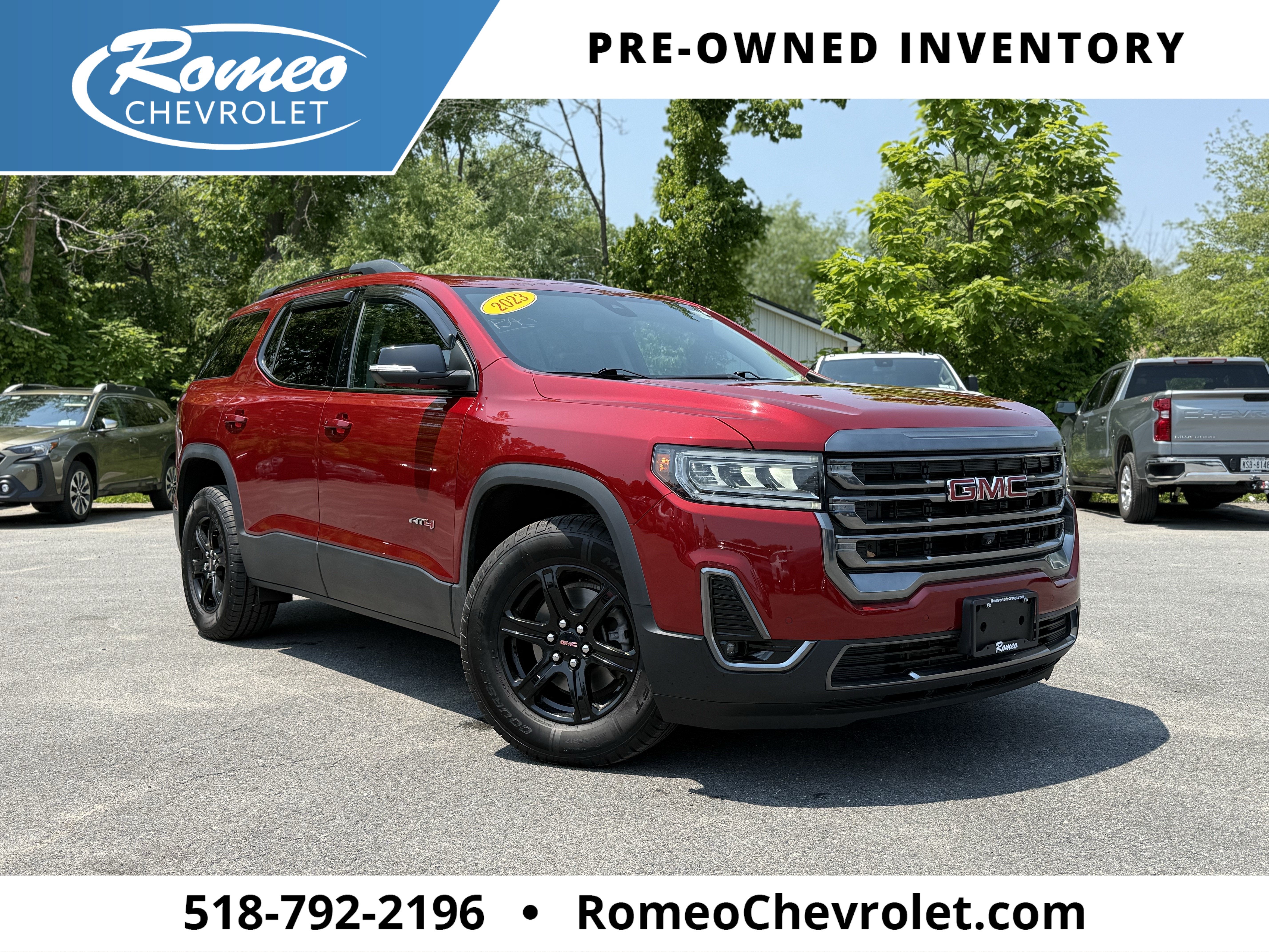 2023 GMC Acadia AT4 in Volcanic Red Tintcoat — front three-quarter view